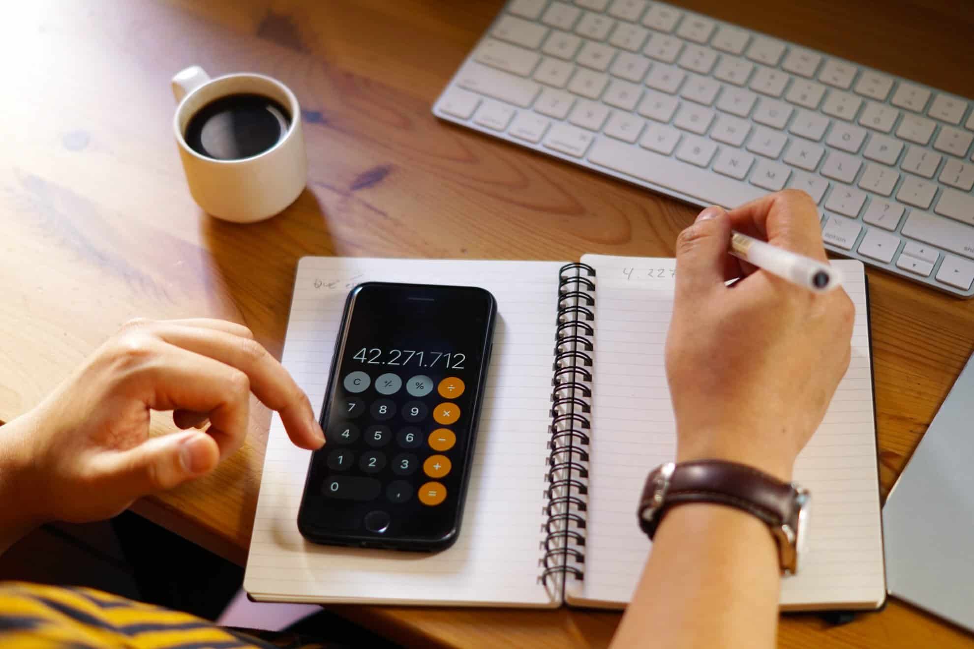 closeup shot entrepreneur working from home doing calculations scaled | Taxwise Australia | 08 6216 4309