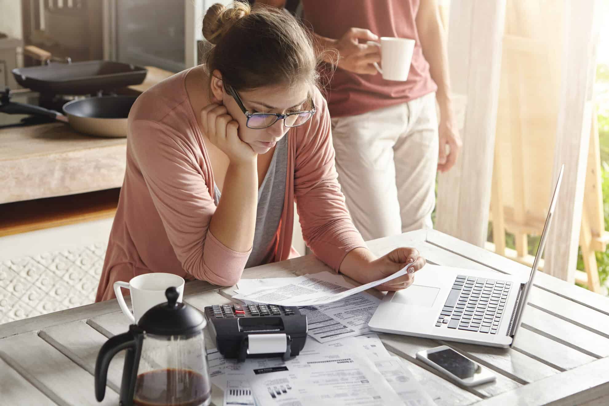 young housewife dressed casually focused paperwork scaled | Taxwise Australia | 08 6216 4309